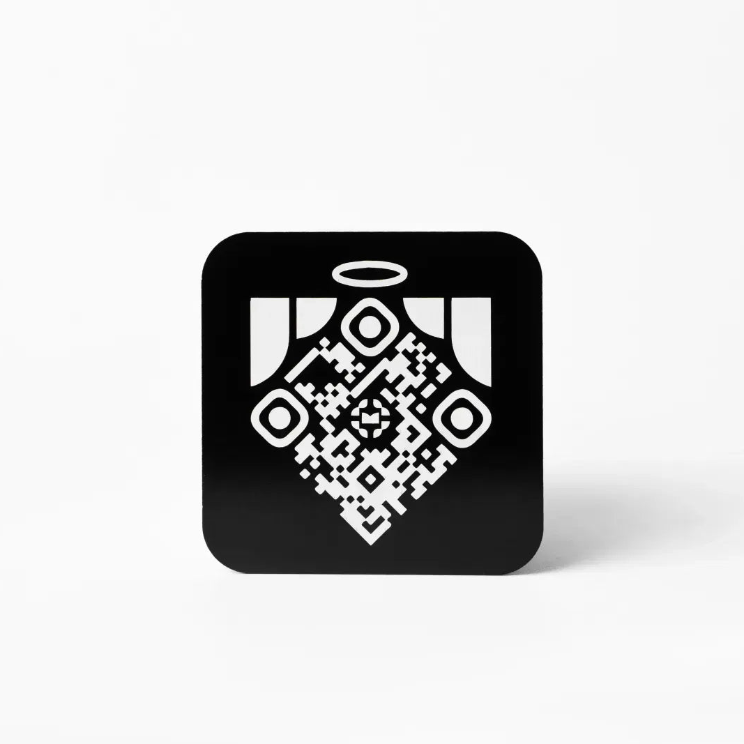 Square Memoriv medallion held in hand