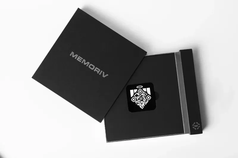 Open Memoriv keepsake box with the QR angel medallion inside