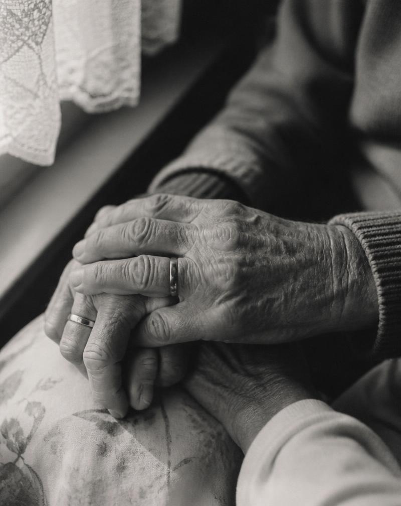 Hands of an elderly couple