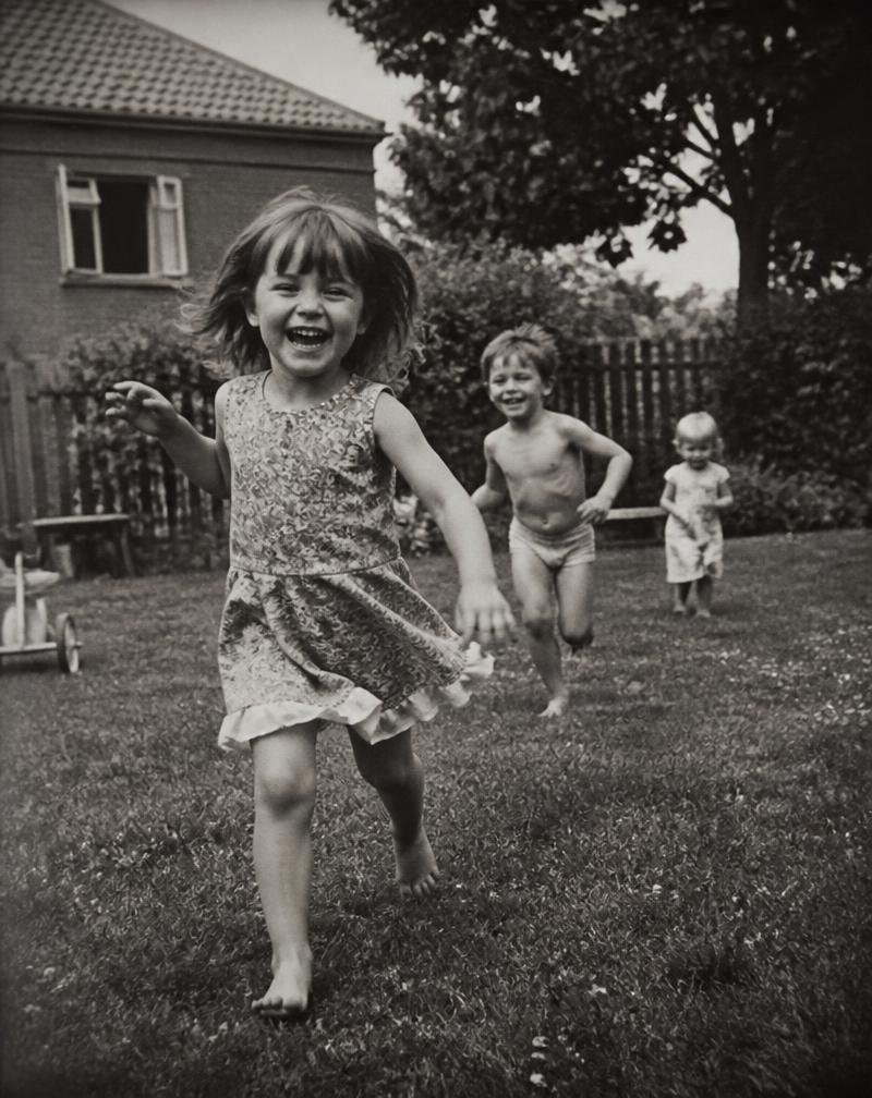 Children running in a summer garden